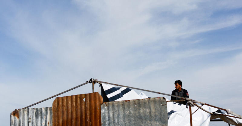 Desperate Gazans pull iron bars from rubble to construct tents and scratch out a living