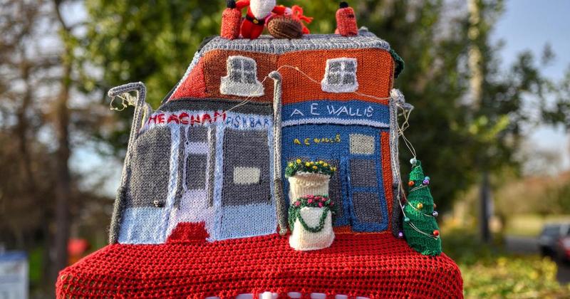 Mystery knitter brings festive cheer to Norfolk village with post box topper Mystery knitter brings festive cheer to Norfolk village with post box topper