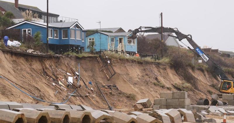 Seven homes on crumbling cliff to be demolished next week Seven homes on crumbling cliff to be demolished next week