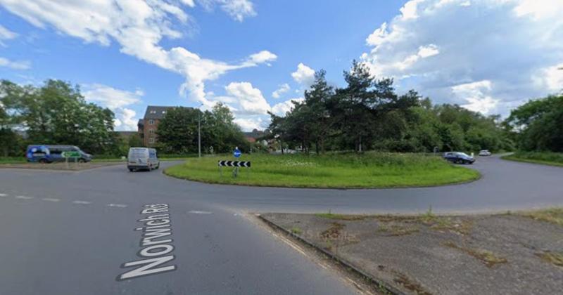 Car left 'upside down' after crash on busy roundabout