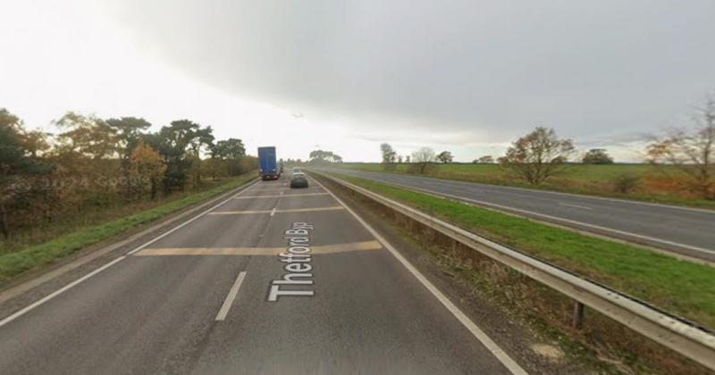 Part of A11 closed after lorry overturns into ditch