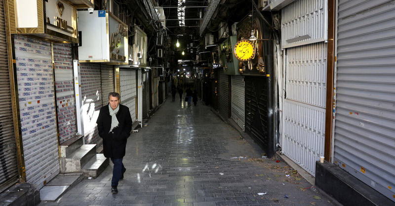 Iran's traders, frustrated by economic losses, turn against clerics