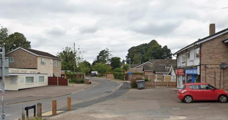 Car rolls onto its side after crashing into street light near bakery