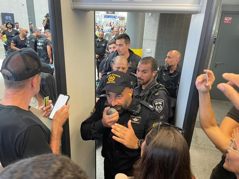 Judge tosses conviction of cop who threw stun grenade at protesters